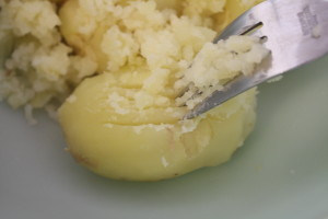 scraping potatoes