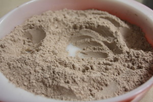 Moon sand with three craters all ready for fillings.