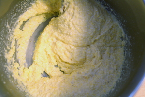 Polenta will become very thick. Note that the furrow formed by draging a spoon across the bottom of the pan doesn't fill in.