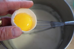 adding egg yolk