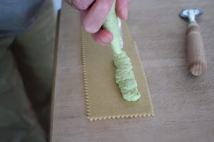 piping filling on pasta sheet