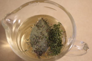 wine with bay leaf and herbs